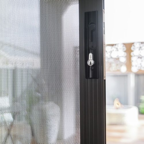 IntrudaGuard sliding door, perforated aluminium screen.